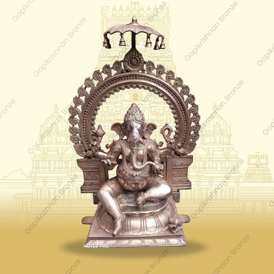 Seated Ganesha with prabhavali and chatram